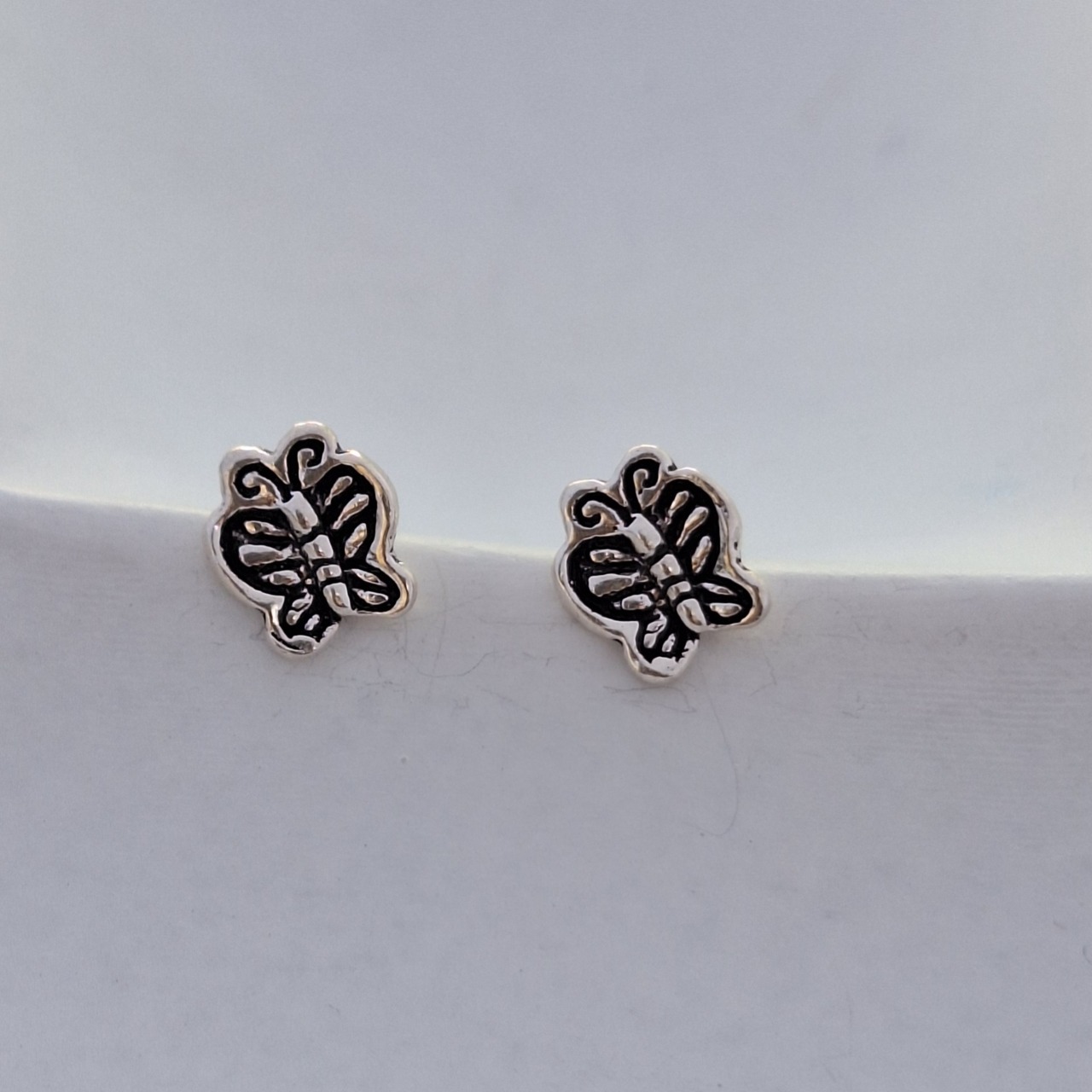 Butterfly oxidized studs